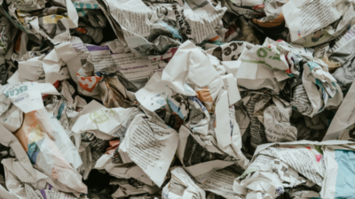a pile of crumpled up newspapers symbolising the spread of disinformation online