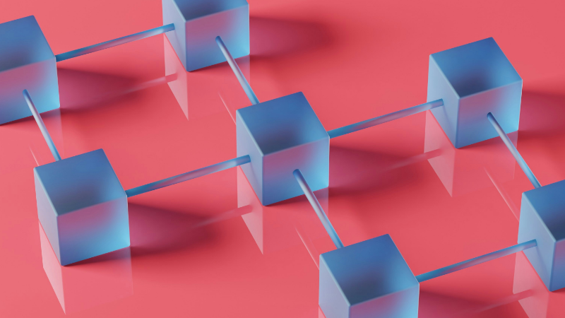 The image shows blue dices that are connected to eachother, symbolising B2B platforms.