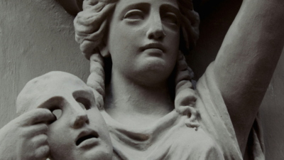 Antique stone statue of a woman holding a mask, symbolising the stolen identities and loss of consent in deepfake pornography."** Let me know if you'd like it adjusted for a specific platform or audience.