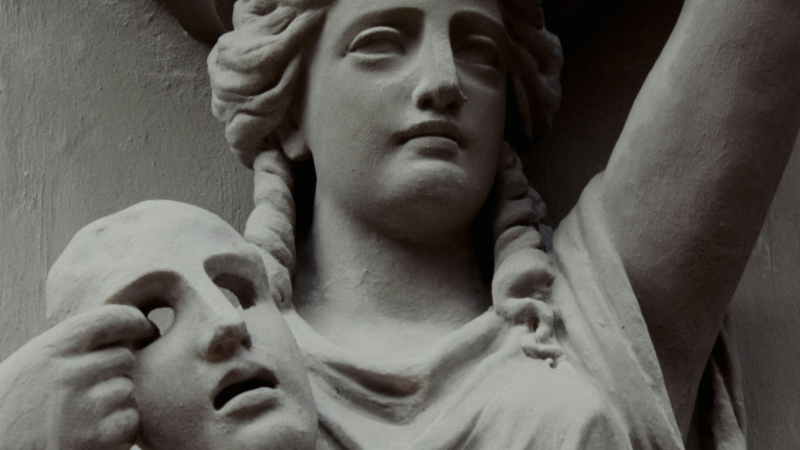 Antique stone statue of a woman holding a mask, symbolising the stolen identities and loss of consent in deepfake pornography."** Let me know if you'd like it adjusted for a specific platform or audience.