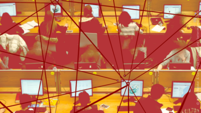 A computer lab with three rows of four desks, each occupied by students working at computers. Overlaying the computer lab are red lines connecting through nodes, symbolizing the flow of communication, data exchange, and interconnected networks.