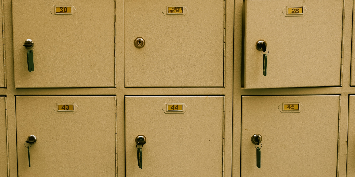 The photo shows yellow lockers, symbolising data protection.