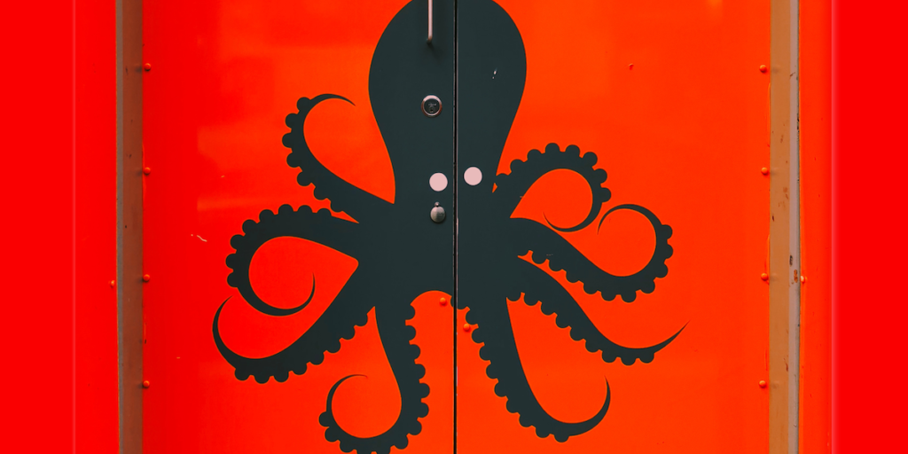 Ein schwarzer Octopus auf rotem Hintergrund.
